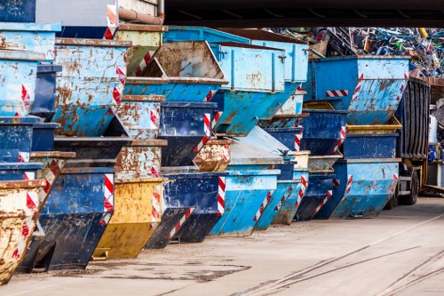 Waste removal truck collecting garbage in Clapham