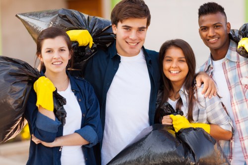 Volunteers and charity partners collecting reusable furniture from a clearance
