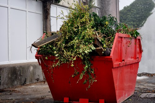 Clapham homeowner sorting through garage clutter with professionals