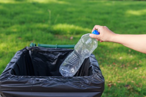 Recyclable materials being organized during a clearance in a London borough home